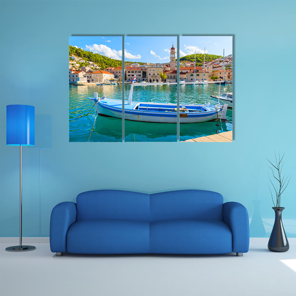 A Church In The Background And A Fishing Boat In Front Multi Panel Canvas Wall Art