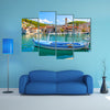 A Church In The Background And A Fishing Boat In Front Multi Panel Canvas Wall Art