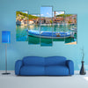 A Church In The Background And A Fishing Boat In Front Multi Panel Canvas Wall Art