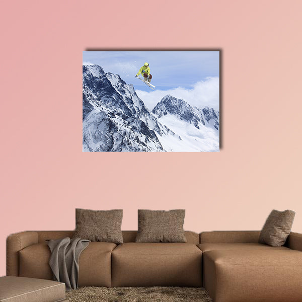 Skier jump in the mountains. Extreme ski sport. Free ride Multi panel canvas wall art