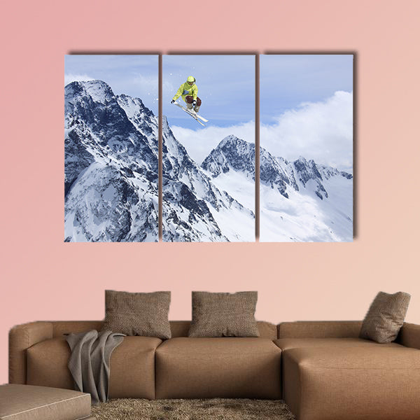 Skier jump in the mountains. Extreme ski sport. Free ride Multi panel canvas wall art