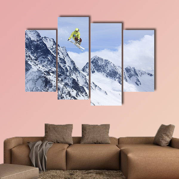Skier jump in the mountains. Extreme ski sport. Free ride Multi panel canvas wall art