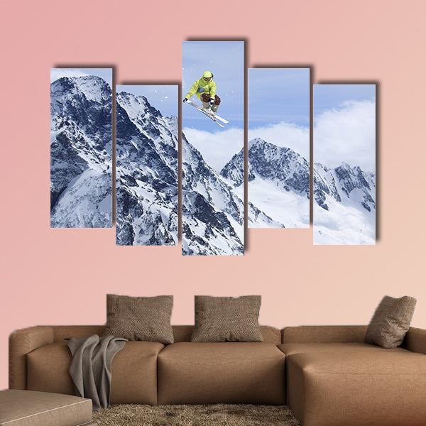 Skier jump in the mountains. Extreme ski sport. Free ride Multi panel canvas wall art