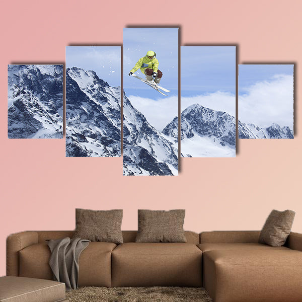 Skier jump in the mountains. Extreme ski sport. Free ride Multi panel canvas wall art