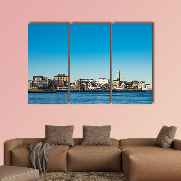 Buildings, lighthouse and blue sky in Warnemuende, Germany wall art
