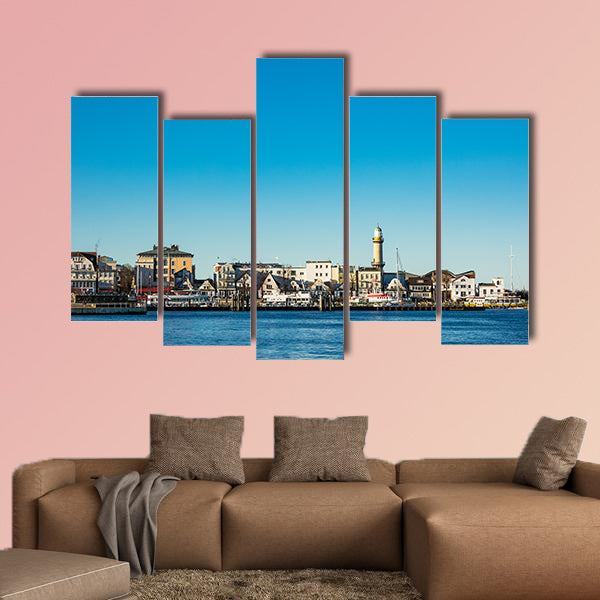 Buildings, lighthouse and blue sky in Warnemuende, Germany wall art