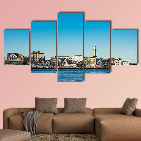 Buildings, lighthouse and blue sky in Warnemuende, Germany wall art