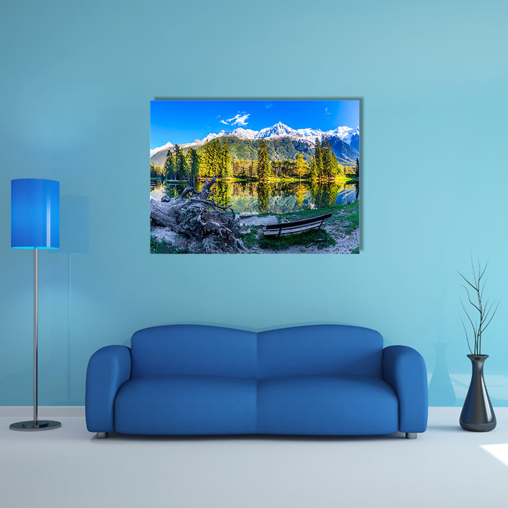The bench in the city park in the Chamonix City Park is illuminated by sunset multi panel canvas wall art