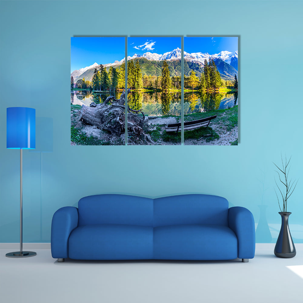 The bench in the city park in the Chamonix City Park is illuminated by sunset multi panel canvas wall art