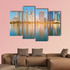 Blue twilight office building with water reflection multi panel canvas wall art