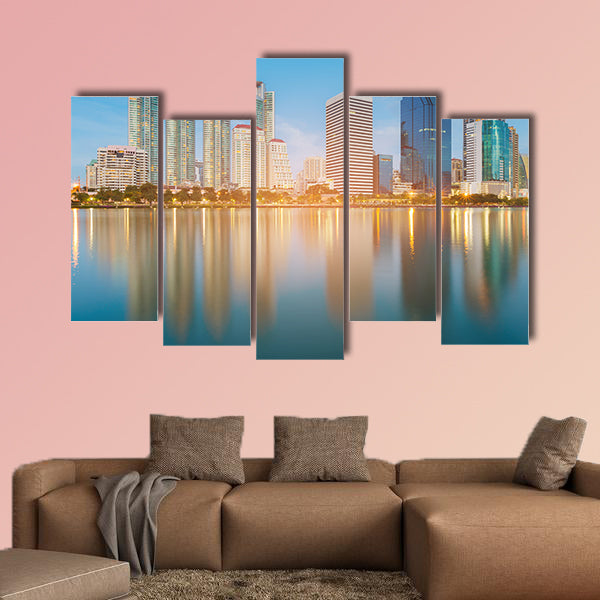 Blue twilight office building with water reflection multi panel canvas wall art