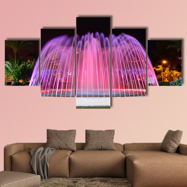 A LED lighted fountain near Mediterranean Sea shore multi panel canvas wall art