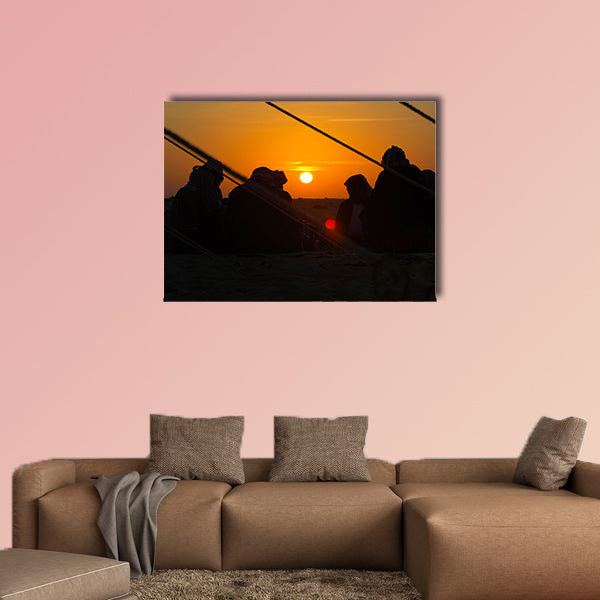 Arab men around a fire place in the desert at sunrise multi panel canvas wall art