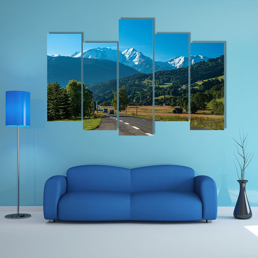 Road between fields, green forest and alpine landscape in a sunny day, multi panel canvas wall art