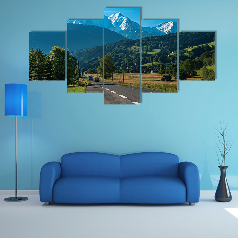 Road between fields, green forest and alpine landscape in a sunny day, multi panel canvas wall art