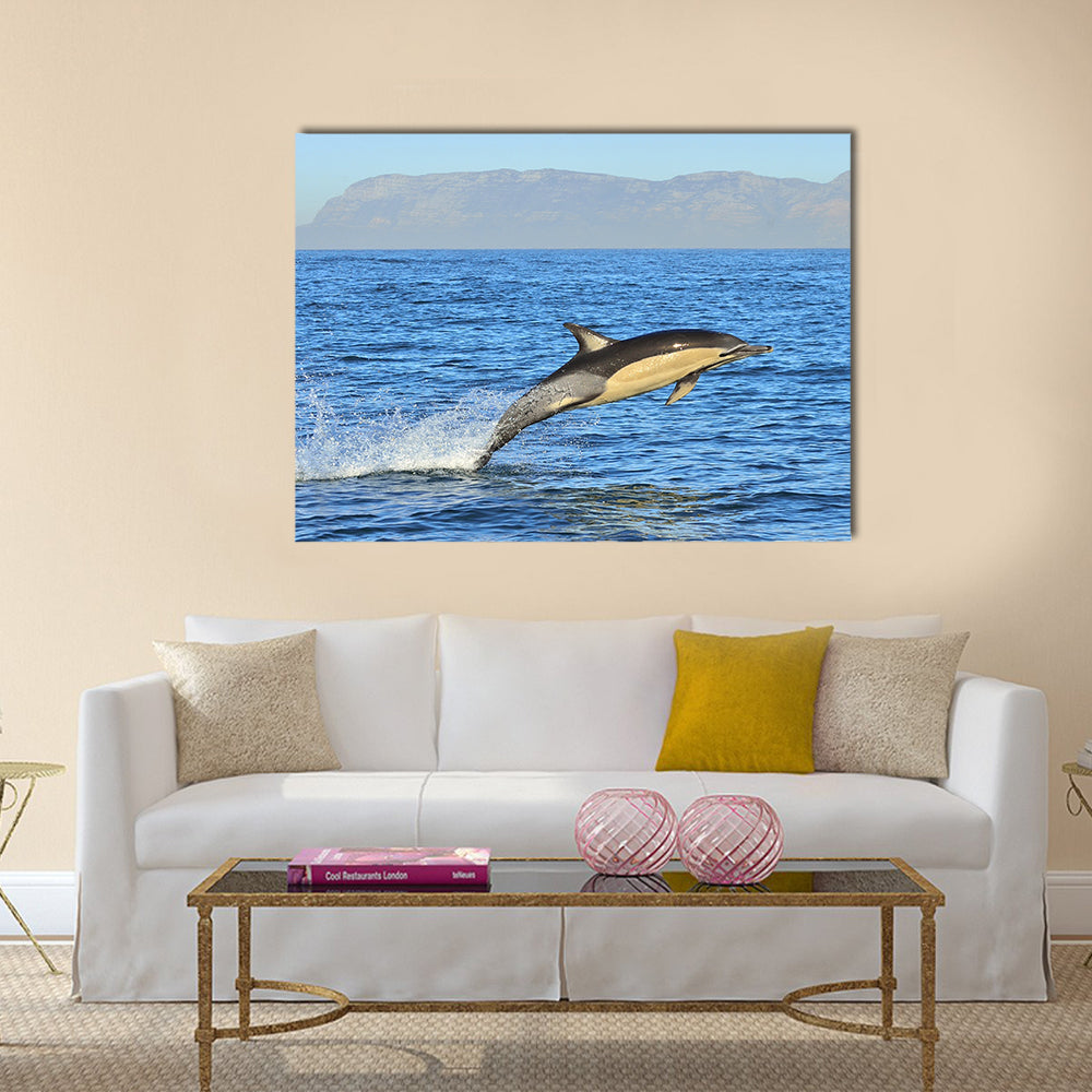 Dolphin, swimming in the ocean and hunting for fish multi panel canvas wall art