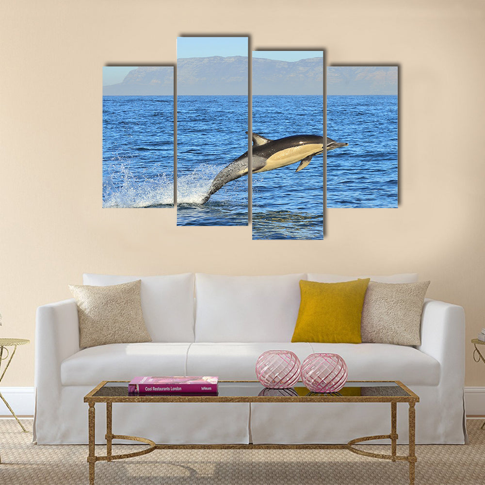 Dolphin, swimming in the ocean and hunting for fish multi panel canvas wall art