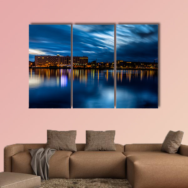 Riga skyline Night shot with scenic water reflections in Daugava River wall art