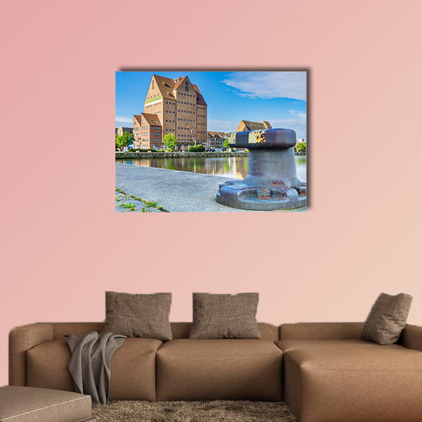 Building in the city harbor of Rostock multi panel canvas wall art