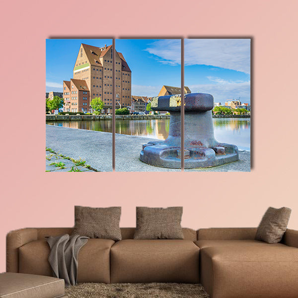 Building in the city harbor of Rostock multi panel canvas wall art