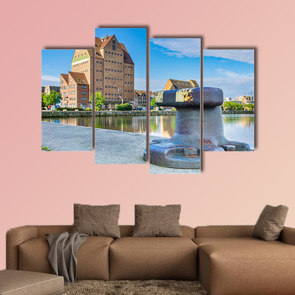 Building in the city harbor of Rostock multi panel canvas wall art