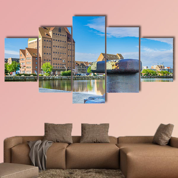 Building in the city harbor of Rostock multi panel canvas wall art