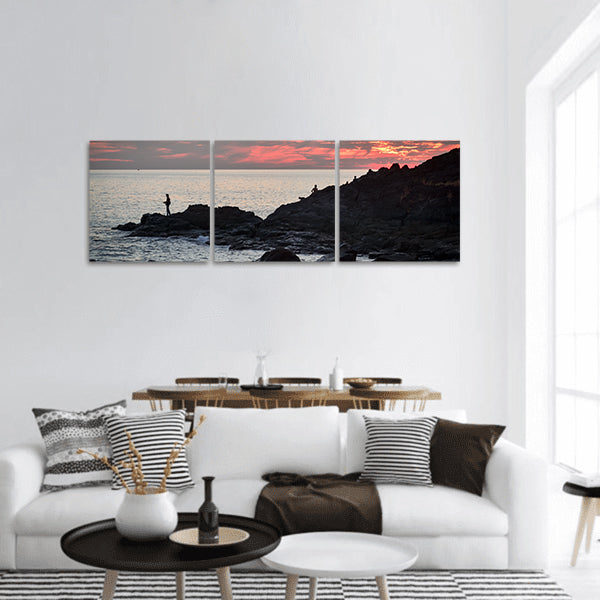 Fisher at cliff coast during sunset Panoramic canvas Wall Art