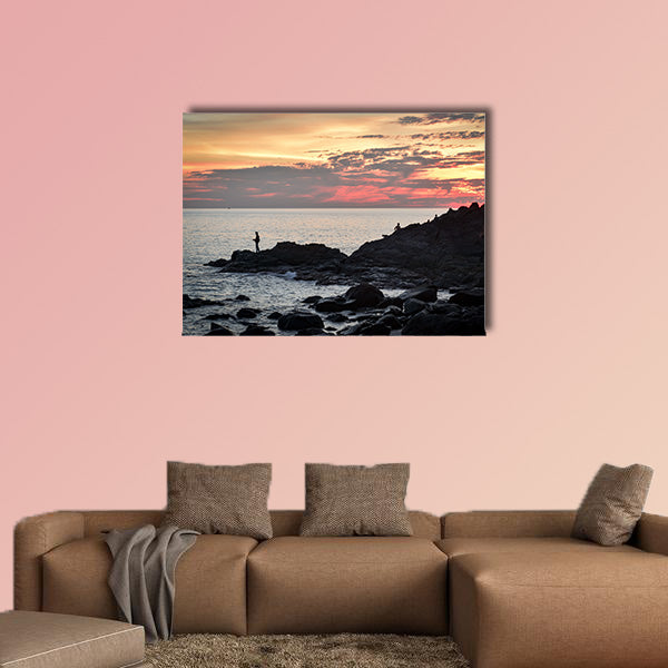 Fisher at cliff coast during sunset Multi panel canvas wall art