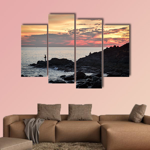 Fisher at cliff coast during sunset Multi panel canvas wall art