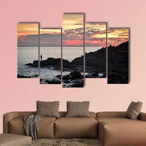 Fisher at cliff coast during sunset Multi panel canvas wall art