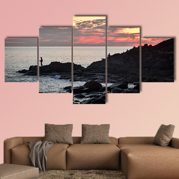 Fisher at cliff coast during sunset Multi panel canvas wall art