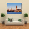 Riga Cathedrals, St. Peters Church Over The Bank Of River Riga, Latvia Multi Panel Canvas Wall Art