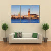 Riga Cathedrals, St. Peters Church Over The Bank Of River Riga, Latvia Multi Panel Canvas Wall Art