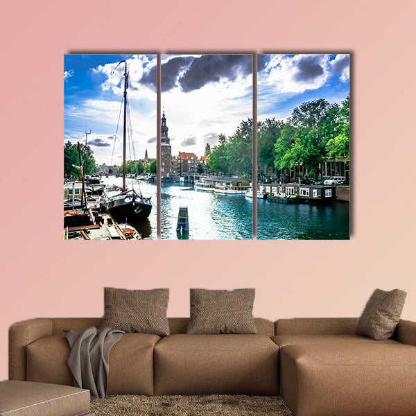 View on canal and traditional buildings in Amsterdam multi panel canvas wall art