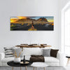 Hiker in sunset at Vestrahorn its black sand beach in Iceland Panoramic canvas Wall Art