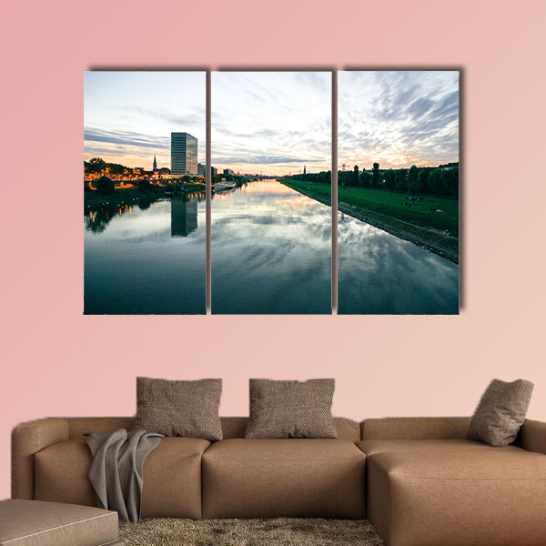 Scenic sunset over a river in a city in Germany multi panel canvas wall art