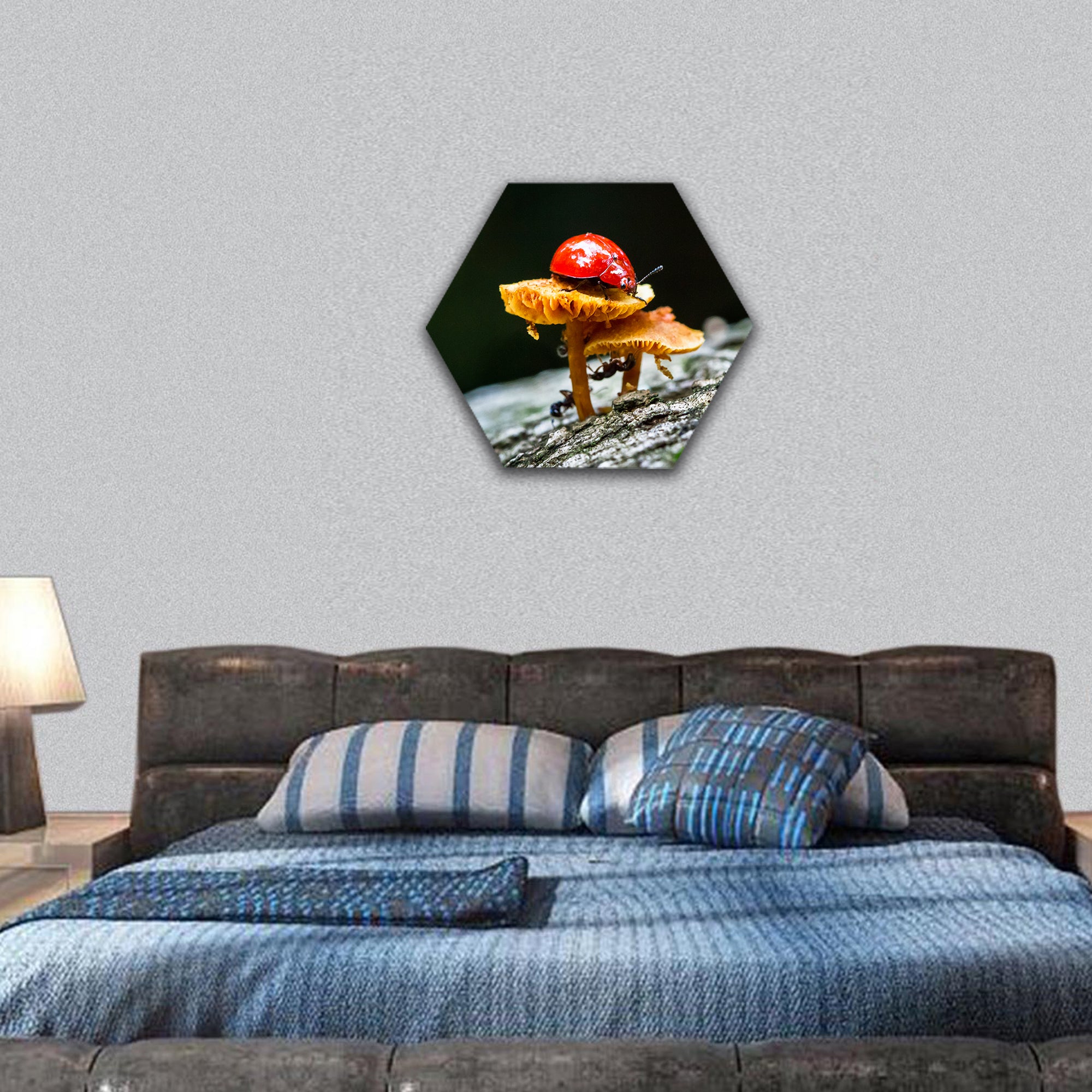 A ladybug sits on a mushroom in the dark jungle hexagonal canvas wall art