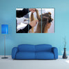 Fixing Hairdo in white make up room, Beauty and haircare concept Multi Panel Canvas Wall Art