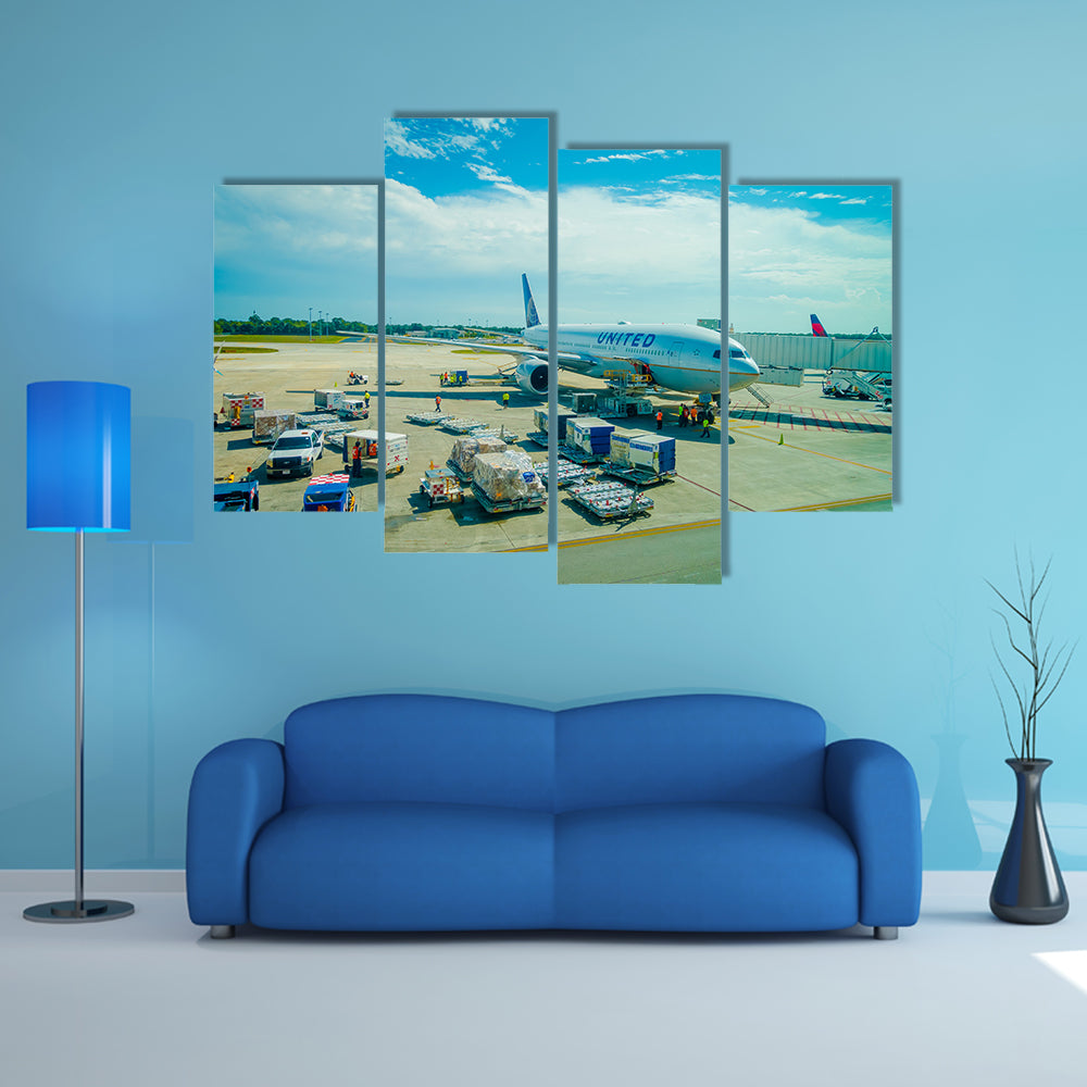 Airplanes on the runway of Cancun International Airport in Mexico Multi Panel Canvas Wall Art