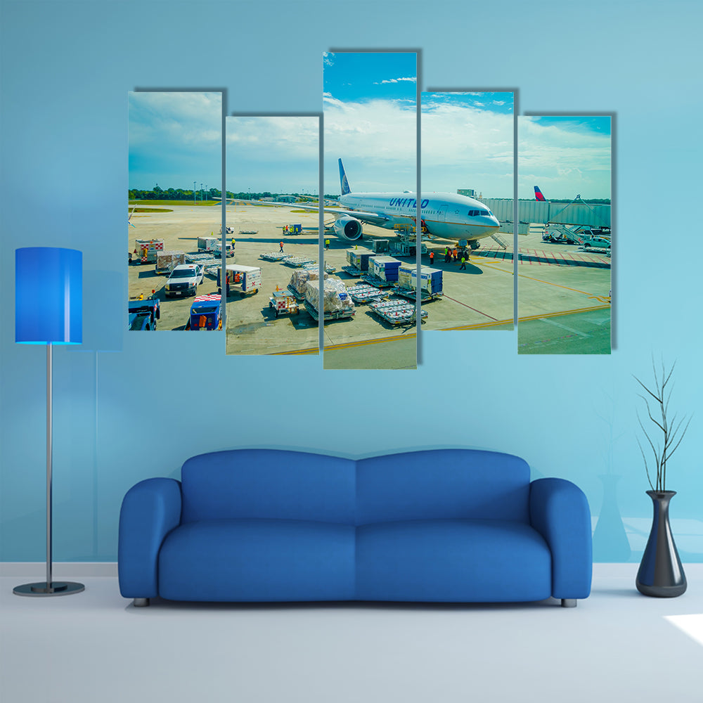 Airplanes on the runway of Cancun International Airport in Mexico Multi Panel Canvas Wall Art