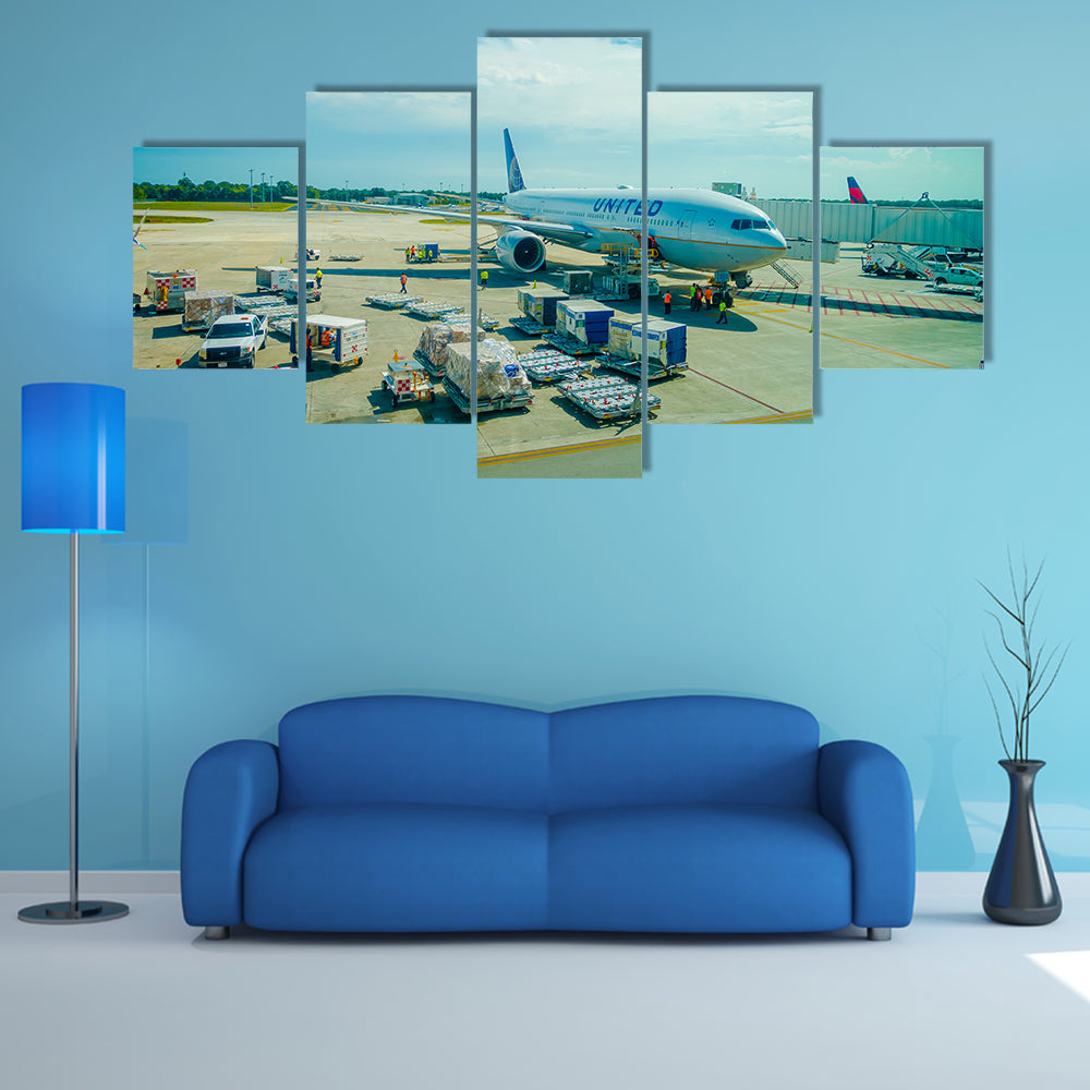 Airplanes on the runway of Cancun International Airport in Mexico Multi Panel Canvas Wall Art