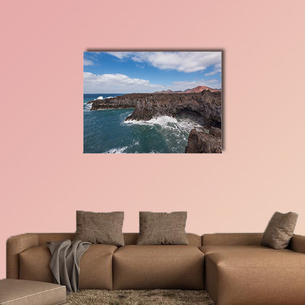 Lanzarote landscape, Los Hervideros coastline, lava caves, cliffs and wavy ocean