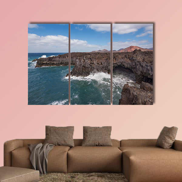 Lanzarote landscape, Los Hervideros coastline, lava caves, cliffs and wavy ocean