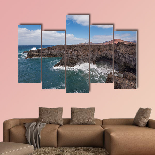 Lanzarote landscape, Los Hervideros coastline, lava caves, cliffs and wavy ocean