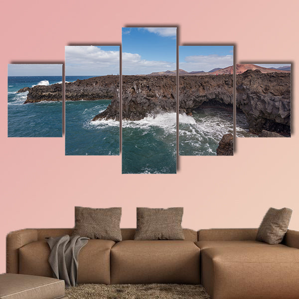 Lanzarote landscape, Los Hervideros coastline, lava caves, cliffs and wavy ocean