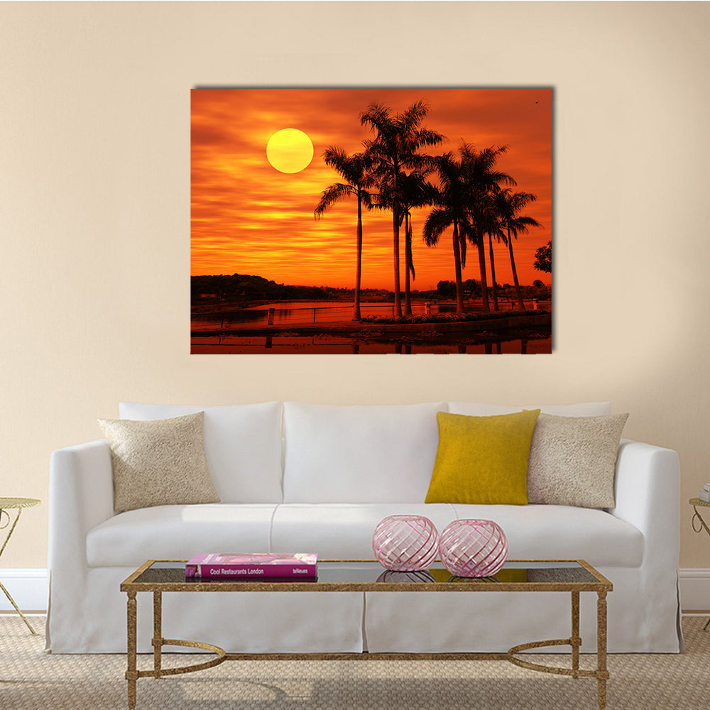 Palm Tree With The Sunset At A Beach Multi Panel Canvas Wall Art