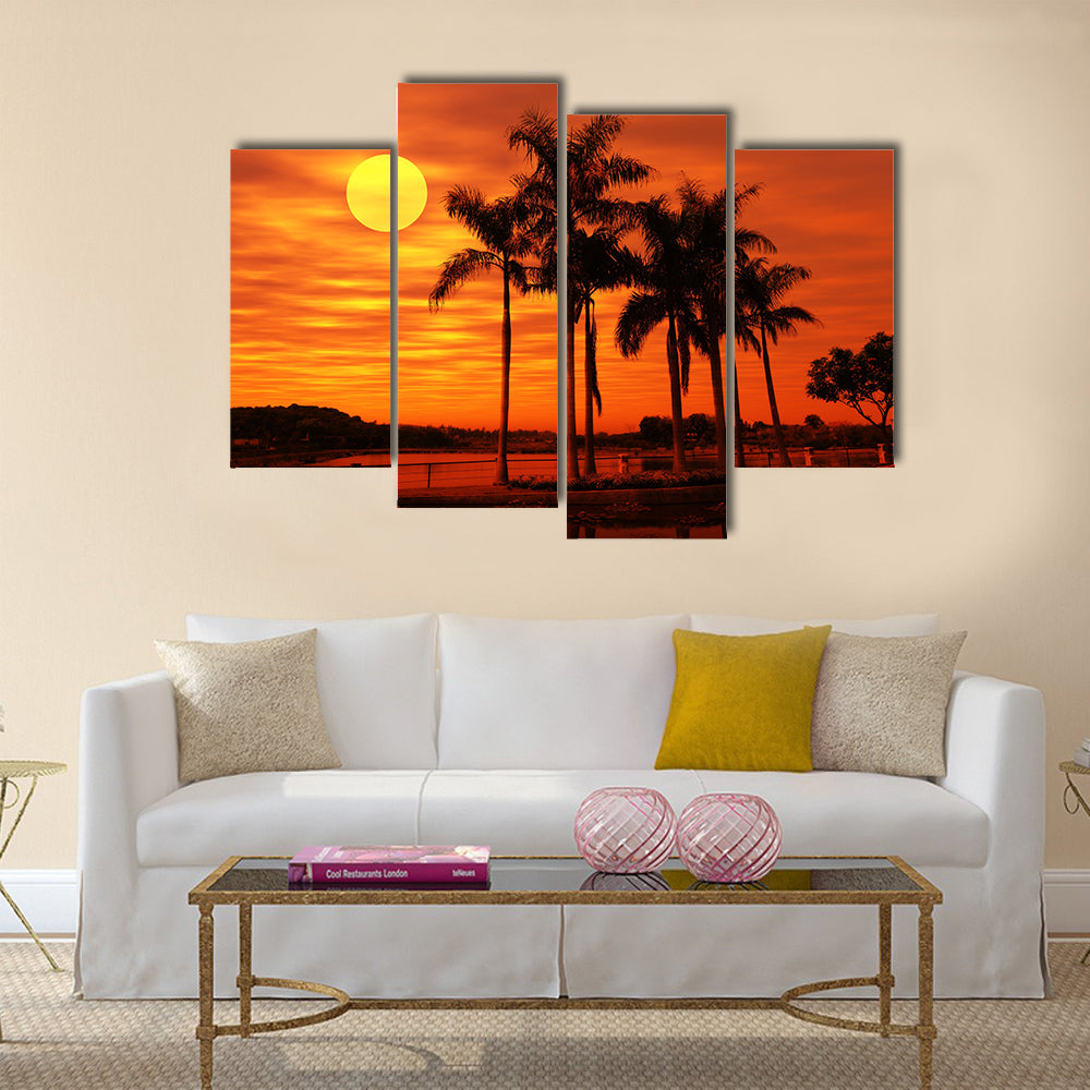Palm Tree With The Sunset At A Beach Multi Panel Canvas Wall Art