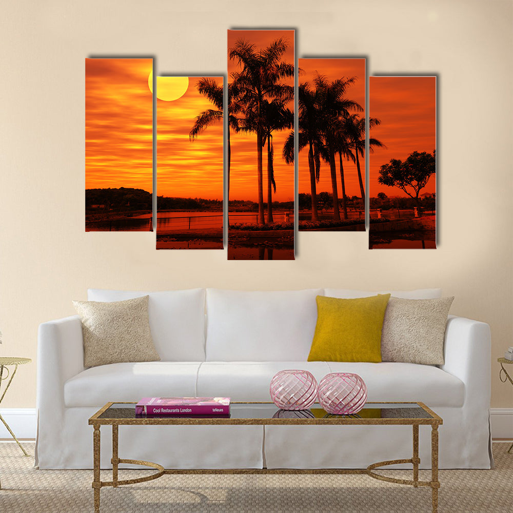 Palm Tree With The Sunset At A Beach Multi Panel Canvas Wall Art