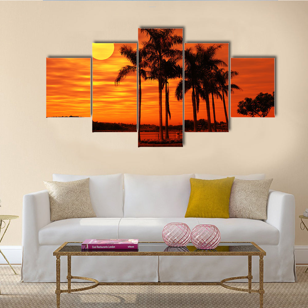 Palm Tree With The Sunset At A Beach Multi Panel Canvas Wall Art