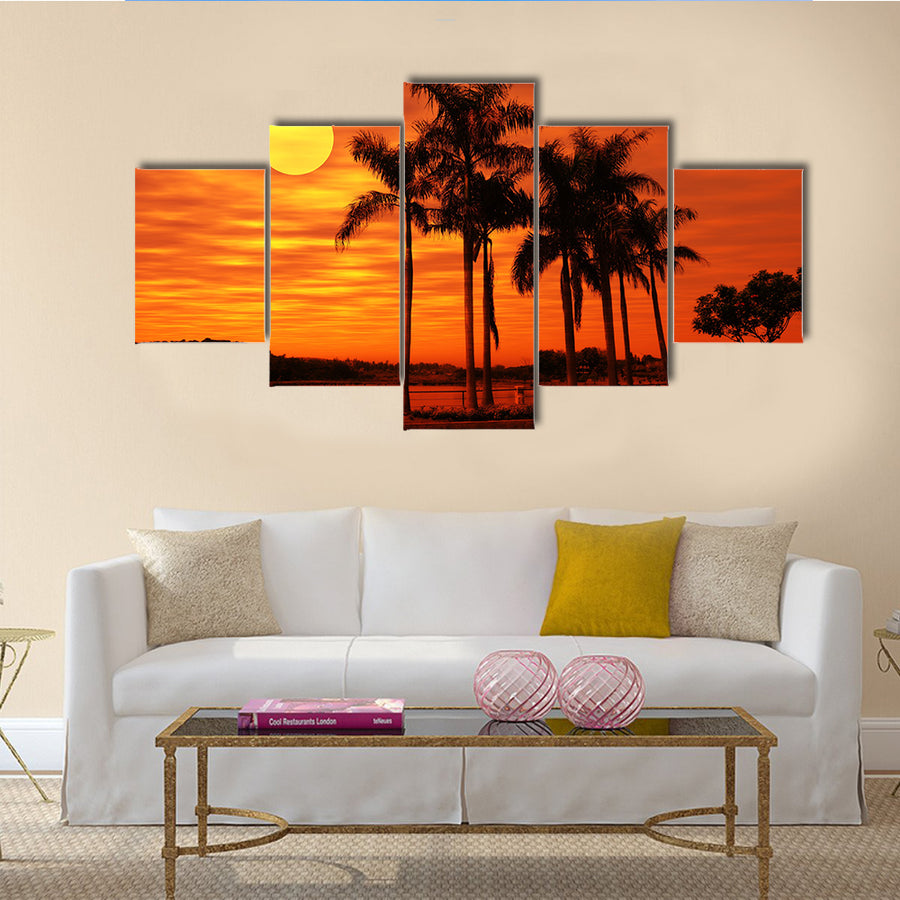 Palm Tree With The Sunset At A Beach Multi Panel Canvas Wall Art